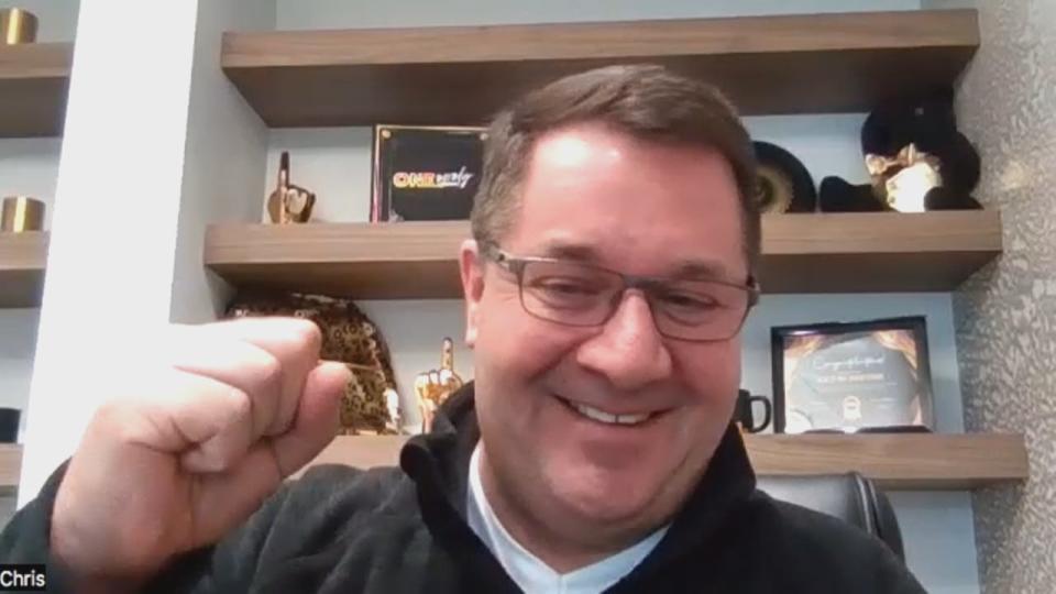 Chris MacLeod, chair of the Downtown Windsor Business Improvement Association, gestures in support of the Detroit Lions during a Zoom interview.