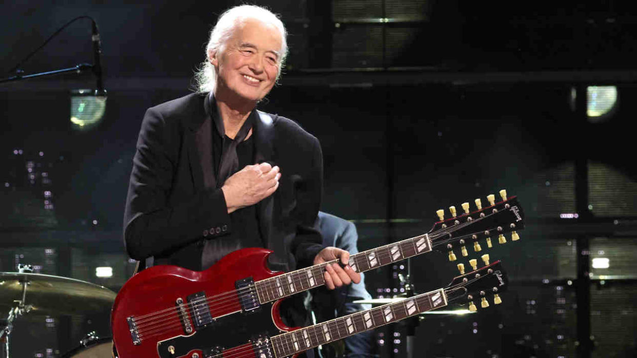  Jimmy Page playing a double necked guitar onstage at the Rock And Roll Hall Of Fame 2023. 