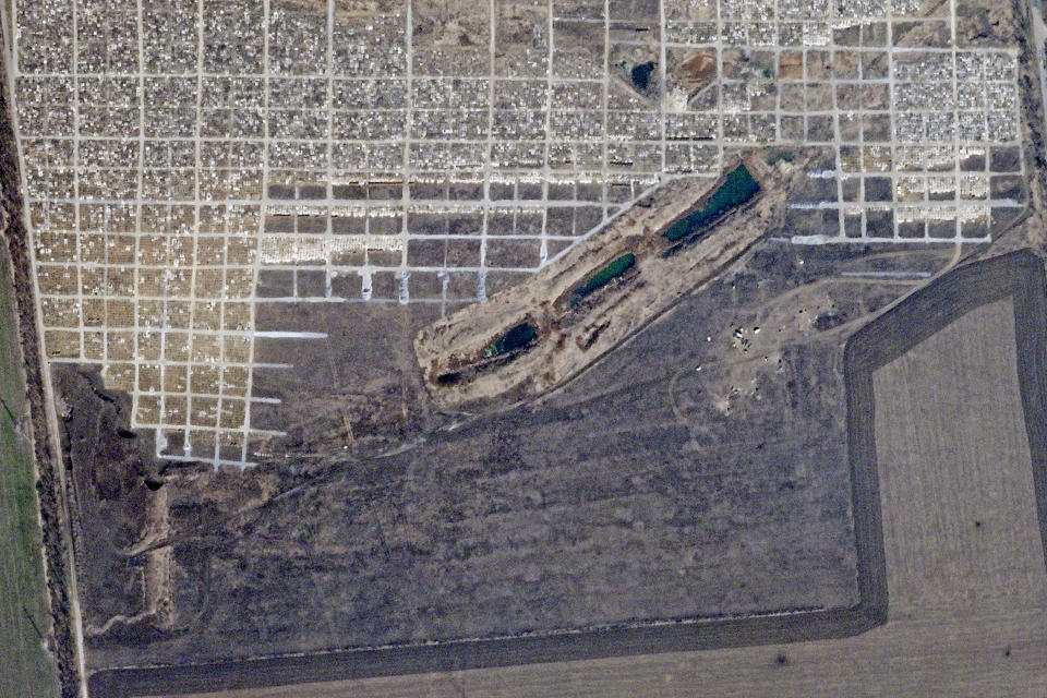 This March 24, 2022, satellite photo from Planet Labs PBC shows an area of a cemetery just northwest of Mariupol, Ukraine. Satellite photos analyzed Tuesday, Nov. 8, 2022, by The Associated Press show a rapid expansion of one cemetery northwest of Mariupol in the months after Russian forces seized the port city on the Sea of Azov. (Planet Labs PBC via AP)