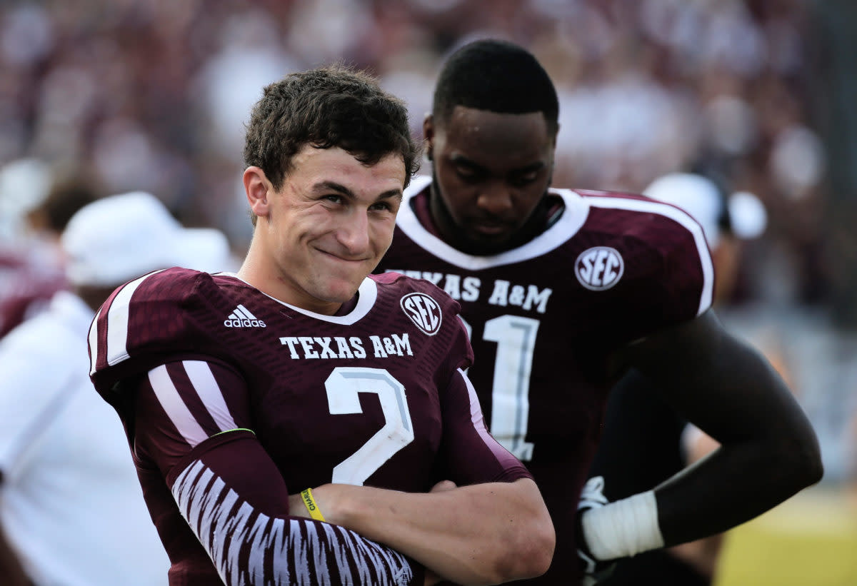 Johnny Manziel smiling in his Texas A&M football uniform.