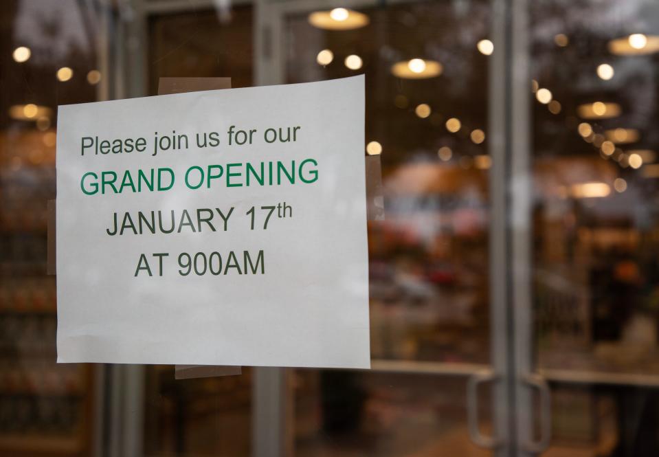 A sign on the door of the new Barnes & Noble location invites customers to their Grand Opening on January 17 at 9 am.