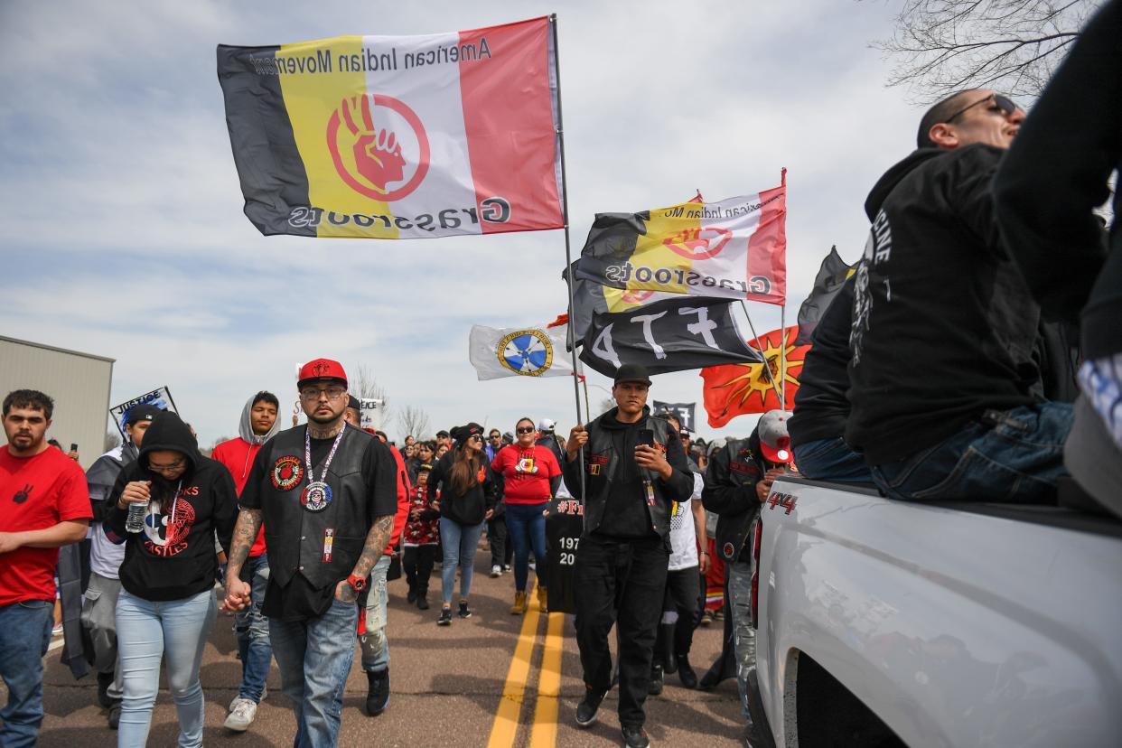 Demonstrators begin walking from Amidon Monument on Friday, April 5, 2024, along North Drive in Sioux Falls.