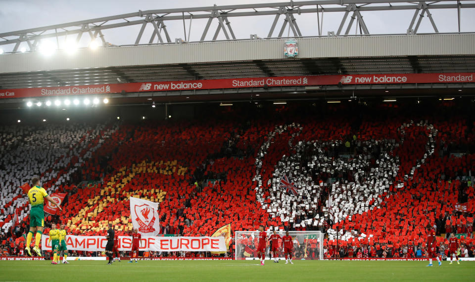 Soccer Football - Premier League - Liverpool v Norwich City - Anfield, Liverpool, Britain - August 9, 2019   Liverpool fans hold up banners to form a tifo before the match    Action Images via Reuters/Carl Recine    EDITORIAL USE ONLY. No use with unauthorized audio, video, data, fixture lists, club/league logos or "live" services. Online in-match use limited to 75 images, no video emulation. No use in betting, games or single club/league/player publications.  Please contact your account representative for further details.