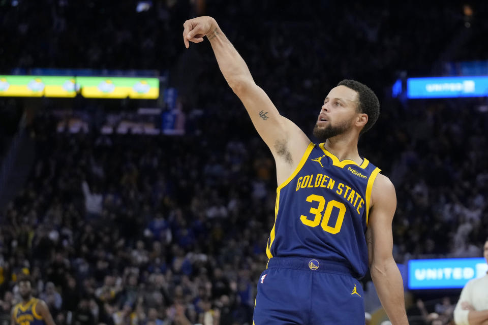 FILE - Golden State Warriors guard Stephen Curry (30) gestures during an NBA basketball game against the Oklahoma City Thunder in San Francisco, Saturday, Nov. 18, 2023. All-Star Saturday Night, Feb. 17, 2024, gets an event like never before: Sabrina Ionescu vs. Stephen Curry, in a 3-point battle of the sexes.(AP Photo/Jeff Chiu, File)