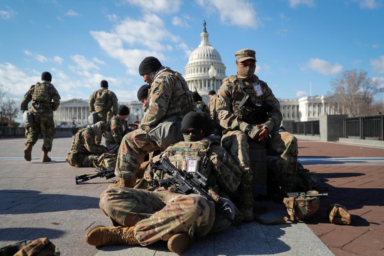 <p>National Guard troops gather in front of the US Capitol in Washington.</p> (Reuters)