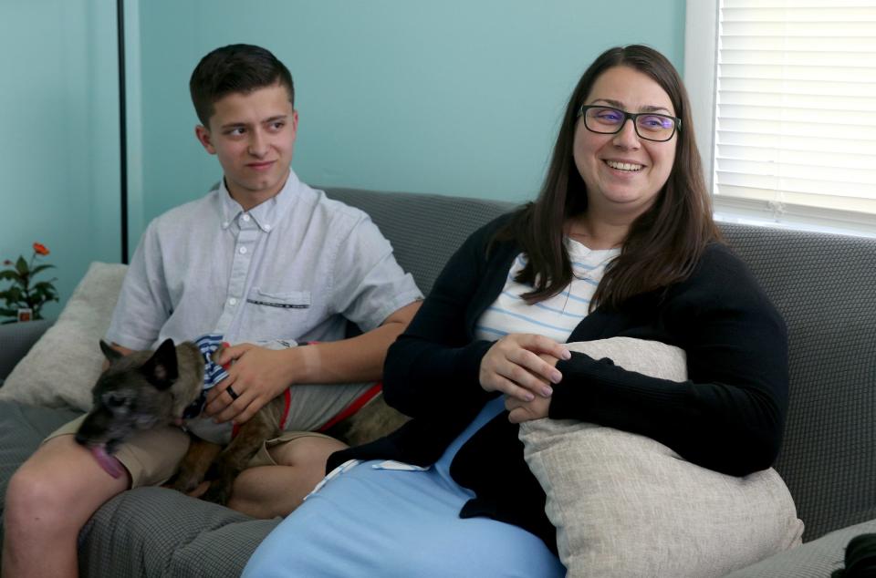 Chale Ashley and her newly adopted son Ashton Ashley are shown in their Farmingdale home Wednesday, May 26, 2022, along with their dog Johnson.  She discussed the challenges of kinship adoption of Ashton who used to be her nephew.