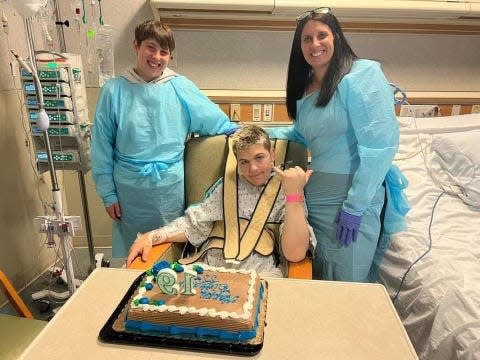 Trevor and Marlana Hodgins celebrating with J.J. Machnik of Howell on his 19th birthday.