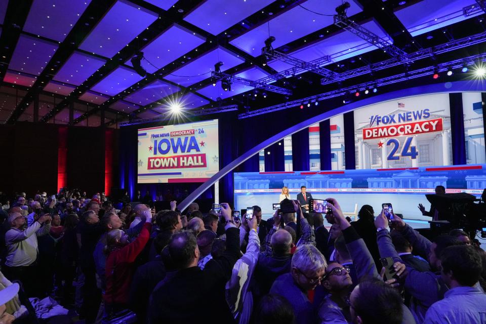 President Donald Trump greets fans at the Fox News town hall at the Iowa Events Center on Wednesday, Jan. 10, 2024, in Des Moines.