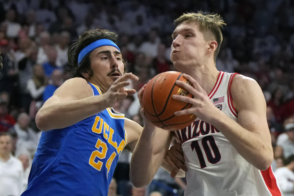 Arizona forward Azuolas Tubelis (10) drives on UCLA guard Jaime Jaquez Jr. during the second half of an NCAA college basketball game, Saturday, Jan. 21, 2023, in Tucson, Ariz. Arizona won 58-52. (AP Photo/Rick Scuteri)