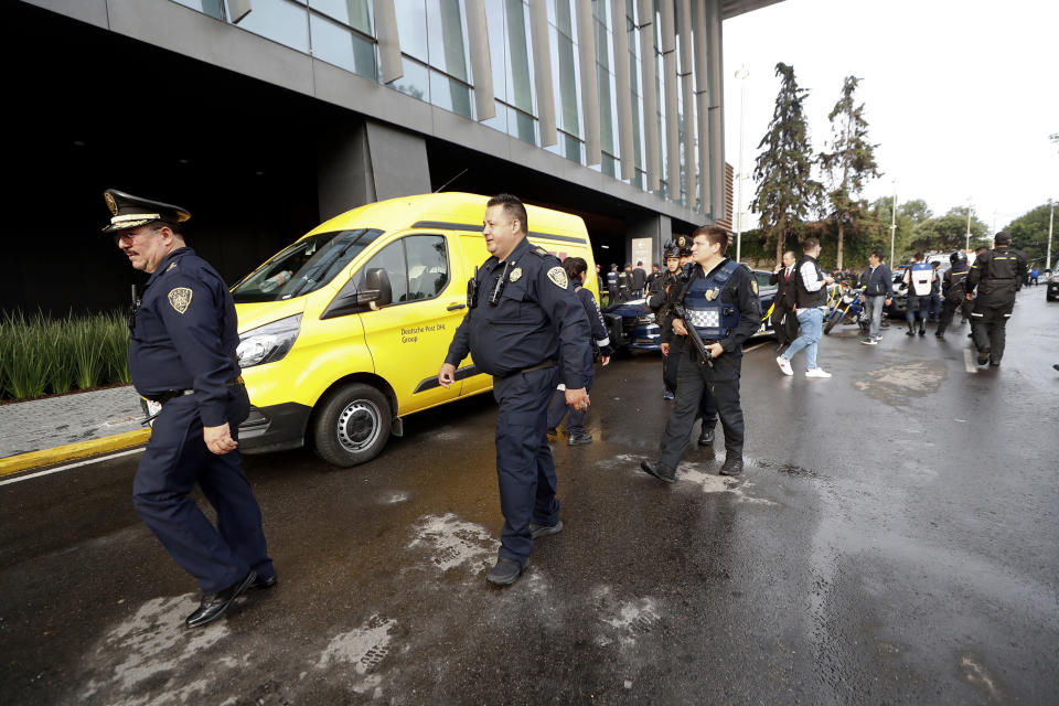 Police arrive at an upscale shopping mall at the south of Mexico City, Wednesday, July 24, 2019, where a woman wearing a blond wig disguise killed two Israeli men. Authorities said the woman and another man sat down at a table near the victims before she rose and shot the two Israelis at close range. According to Mexico City police chief Jesus Orta the woman said, "she had a sentimental relationship with one of the victims, who she met on social media, and that the attack was due to infidelity." (AP Photo)