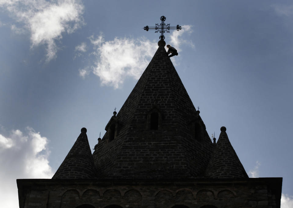 French climber Alain Robert, also known as "Spiderman", climbs on the Abbey in St-Maurice October 3, 2012. REUTERS/Denis Balibouse