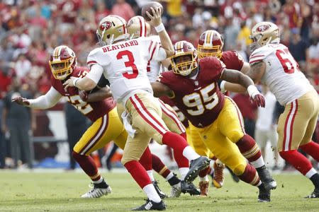 Oct 15, 2017; Landover, MD, USA; San Francisco 49ers quarterback C.J. Beathard (3) passes the ball as Washington Redskins defensive end Jonathan Allen (95) chases in the second quarter at FedEx Field. Mandatory Credit: Geoff Burke-USA TODAY Sports