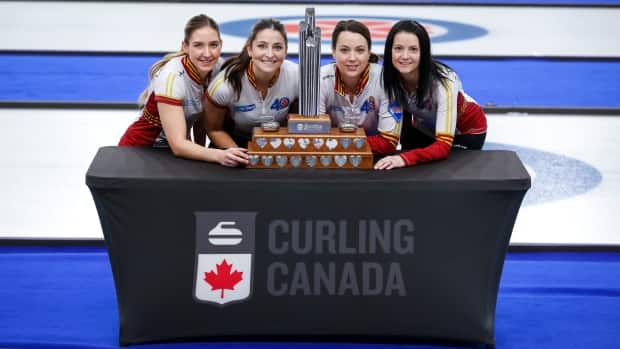 Skip Kerri Einarson, far right, and her Manitoba foursome will get the opportunity to play in the women's world championship in Calgary in April and fight for a spot in the 2022 Beijing Olympics. (Jeff McIntosh/The Canadian Press - image credit)