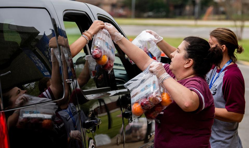 Schools across the country — including Prattville Intermediate School, shown here on March 18, 2020 — used off-site food distribution points to get meals in the hands of children who were attending virtual school during the COVID pandemic. An early 2022 Alabama state school board audit of Montgomery's LEAD Academy school meal program found problems with the school's claims for reimbursement and has demanded it return nearly $1.9 million, which it has already paid to its meal vendor.