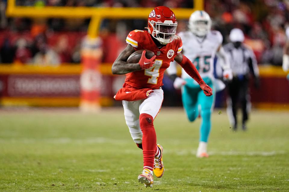 Jan 13, 2024; Kansas City, Missouri, USA; Kansas City Chiefs wide receiver Rashee Rice (4) runs the ball against the Miami Dolphins during the second half of the 2024 AFC wild card game at GEHA Field at Arrowhead Stadium. Mandatory Credit: Jay Biggerstaff-USA TODAY Sports