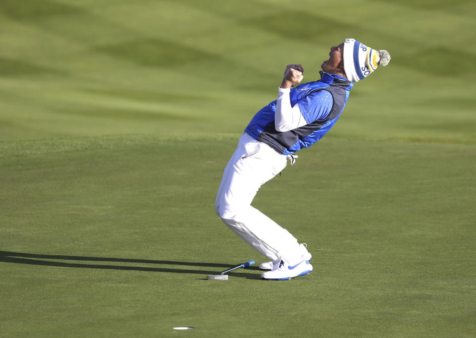 Suzann Pettersen of Europe celebrates after holing a putt on the 18th green to win the Solheim Cup against the US at Gleneagles, Auchterarder, Scotland, Sunday, Sept. 15, 2019. (AP Photo/Peter Morrison)