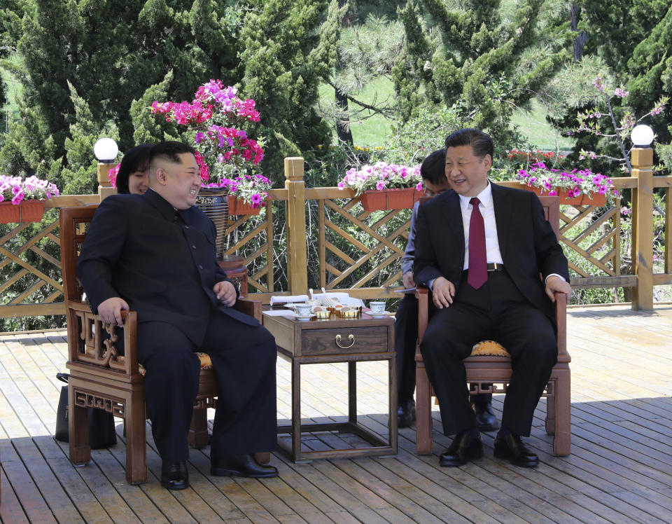 FILE - In this file photo taken between May 7 and 8, 2018, released by China's Xinhua News Agency, Chinese President Xi Jinping, right, speaks to North Korean leader Kim Jong Un in Dalian in northeastern China's Liaoning Province. As North Korea celebrates the 70th anniversary of its founding on Sunday, Sept. 9, 2018, the presence - or absence - of Xi could highlight just how much vitality has been restored to ties between Pyongyang and its most powerful backer after a prolonged chill. (Ju Peng/Xinhua via AP, File)