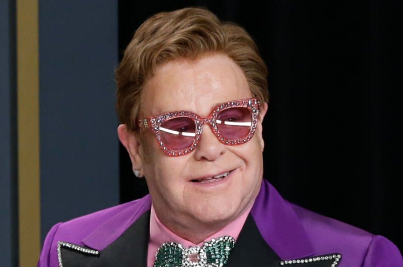 Elton John, winner of Best Original Song for "(I'm Gonna) Love Me Again" for "Rocketman," appears backstage with his Oscar during the 92nd annual Academy Awards at Loews Hollywood Hotel in Los Angeles on February 9, 2020. The singer turns 77 on March 25. File Photo by John Angelillo/UPI