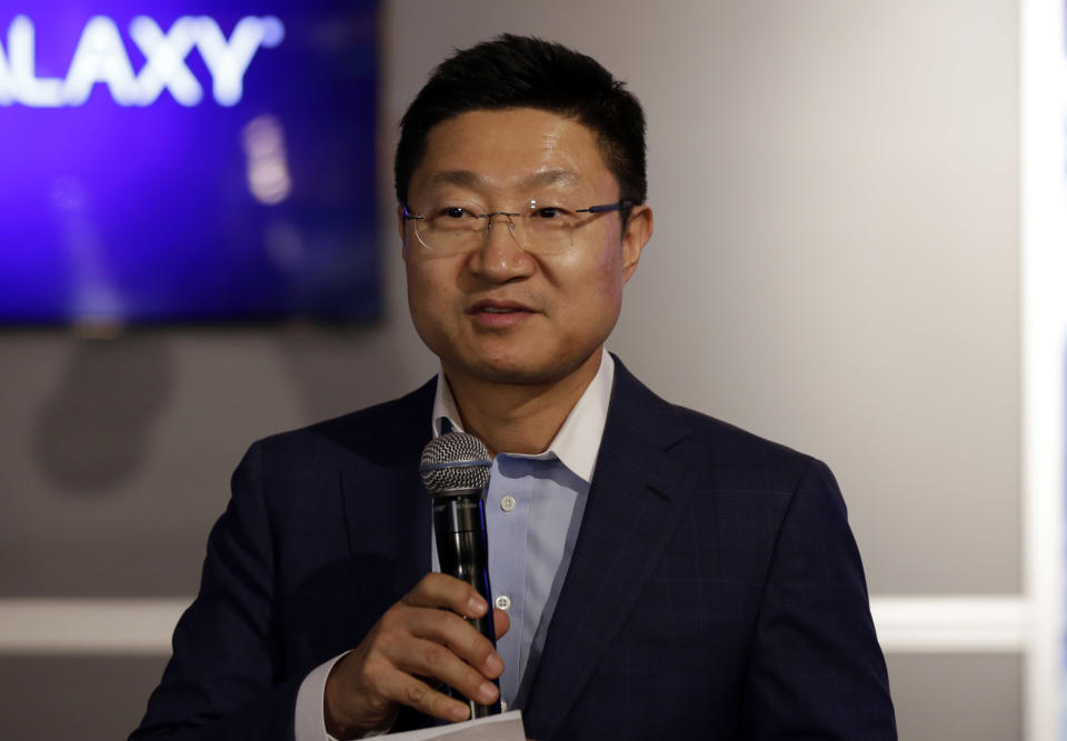 Samsung Electronics North America President & CEO Gregory Lee delivers opening remarks at the introduction of the Samsung Galaxy S5 smartphone at the Samsung Galaxy Studio, in New York, Monday, Feb. 24, 2014. (AP Photo/Richard Drew)