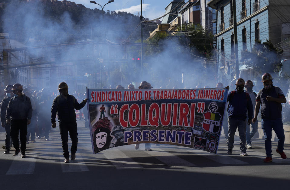 Miners hols a banner of their union while protesting against the jailed opposition leader and governor of Santa Cruz region, Luis Fernando Camacho, during a march in La Paz, Bolivia, Thursday, Jan. 12, 2023. Prosecutors on Dec. 29 remanded Camacho into custody for four months while he faces terrorism charges. (AP Photo/Juan Karita)