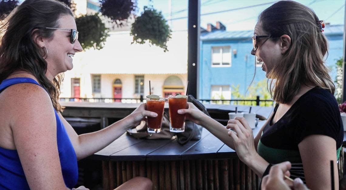 Sister-in-laws, Maggie Lloyd, left, and Charlotte Lloyd toast a pair of Bloody Mary’s at Humble Pie in Raleigh Sunday, July 9, 2017. Travis Long/tlong@newsobserver.com