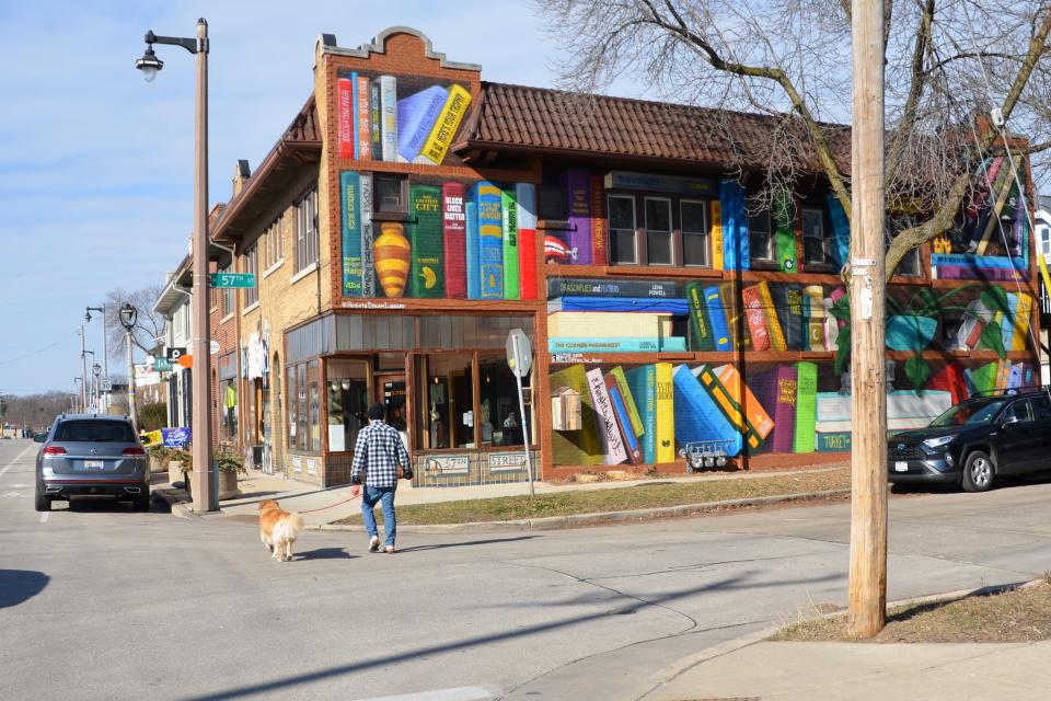 The Heights Dream Library is on the side of a building that houses Rainbow Booksellers in Milwaukee's Washington Heights.