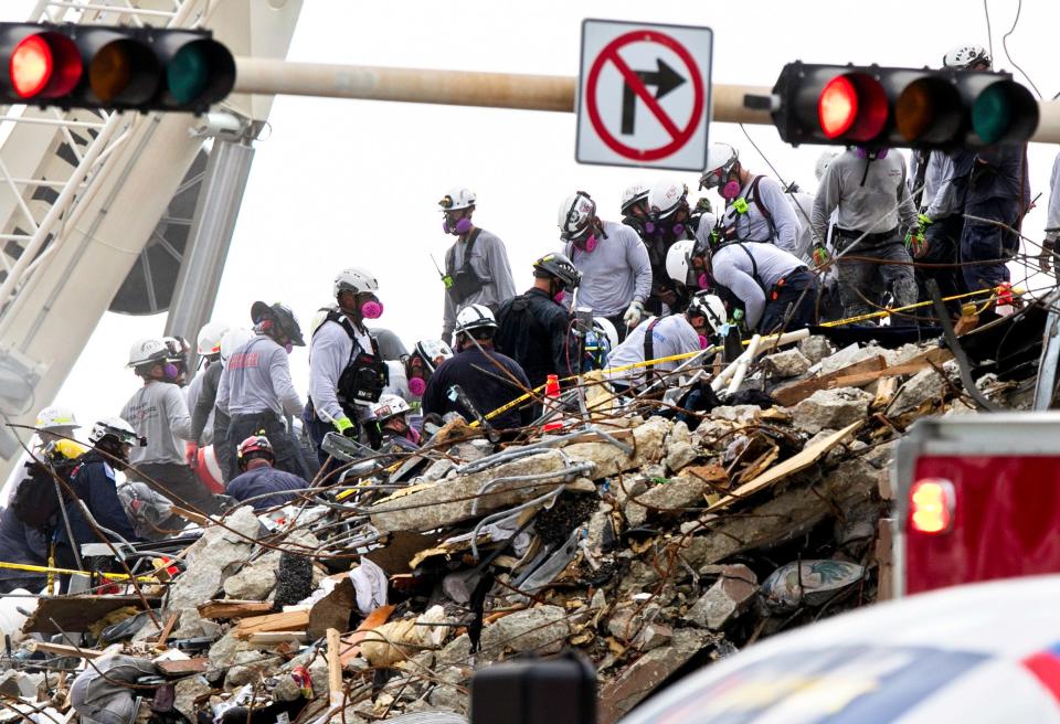 Searchers dig through rubble at the base of Champlain Towers South condo in Surfside, Fla., on June 29. The condominium partially collapsed  June 24.