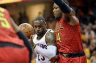 May 4, 2016; Cleveland, OH, USA; Cleveland Cavaliers forward LeBron James (23) drives into Atlanta Hawks forward Paul Millsap (4) during the second quarter in game two of the second round of the NBA Playoffs at Quicken Loans Arena. Mandatory Credit: Ken Blaze-USA TODAY Sports