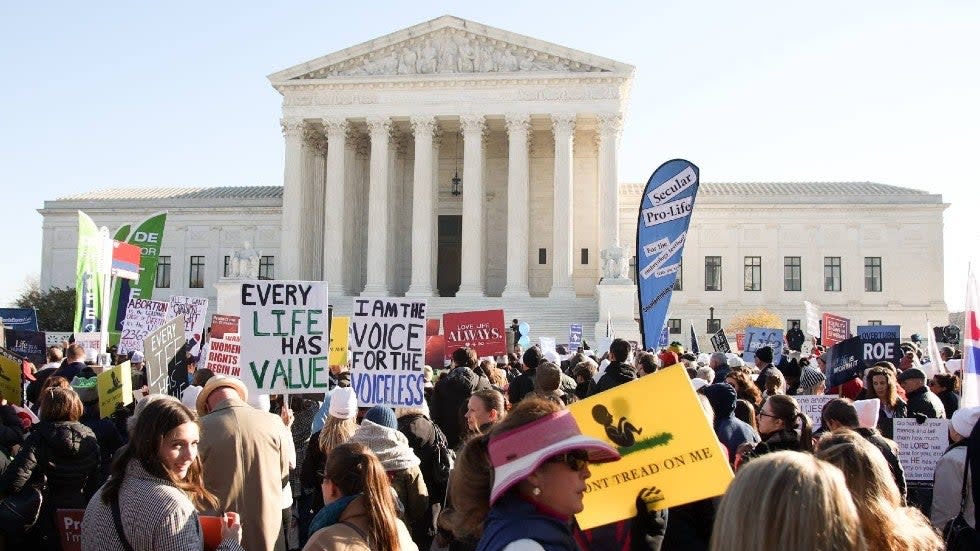 Protesters outside Supreme Court as justices hear arguments in high-profile abortion case
