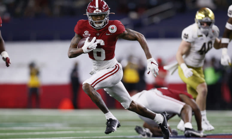Wide receiver DeVonta Smith #6 of the Alabama Crimson Tide carries the ball for a touchdown