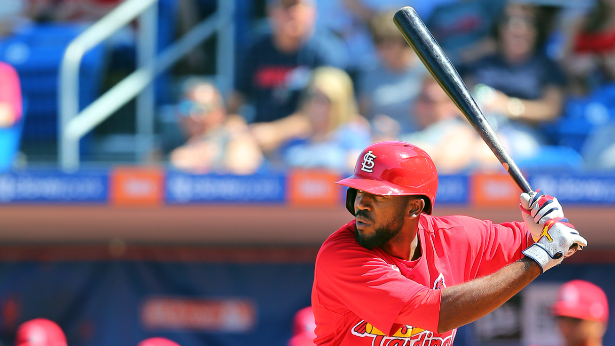 a baseball player swinging a bat