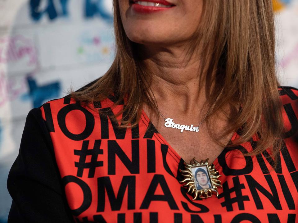 Patricia Oliver, whose son Joaquin Oliver was killed in the Parkland shooting, wears a medallion with a picture of Joaquin and a necklace bearing his name during the opening of the 