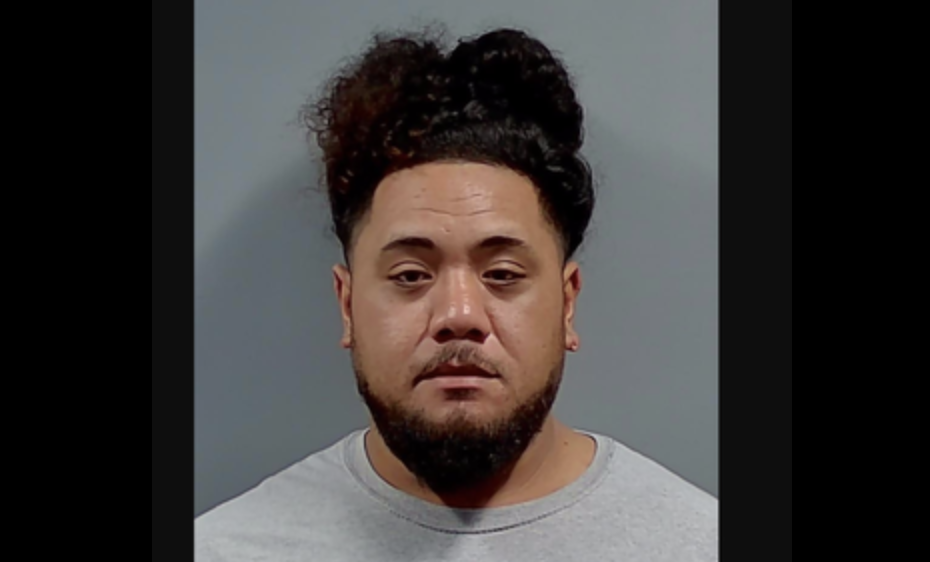 Carlos Feituuaki Tuifua, 28, is accused of improperly exhibiting his weapon at a bar, where he unintentionally shot himself (Escambia County Jail View)