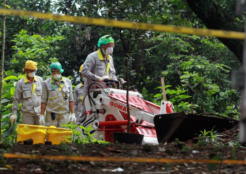 The National Nuclear Energy Agency of Indonesia (BATAN) and Nuclear Energy Regulatory Agency (BAPETEN) decontaminate the soil that is exposed to radioactive waste in the residential area of Batan Indah, Tangerang, near Jakarta