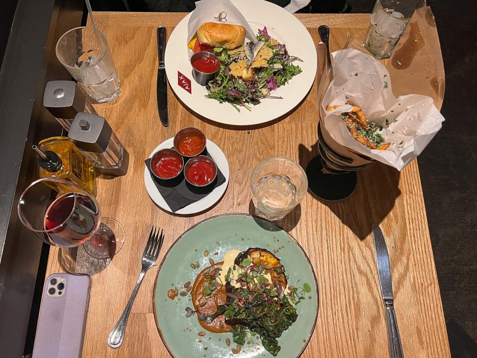 Squash, a wagyu burger, and truffle fries from Ajax Tavern.