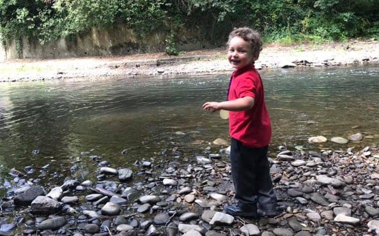 Logan Williamson pictured near a river in his school uniform - Wales News