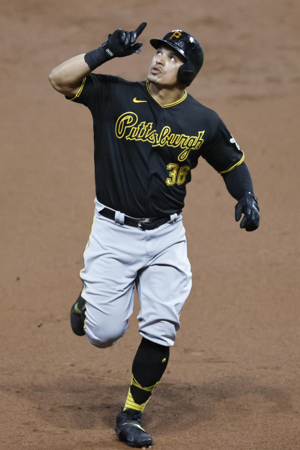 Pittsburgh Pirates' Jose Osuna celebrates as he rounds the bases after hitting a solo home run off Cleveland Indians pitcher Aaron Civale during the second inning of a baseball game, Saturday, Sept. 26, 2020, in Cleveland. (AP Photo/Ron Schwane)