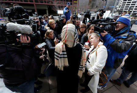 A supporter of former Minneapolis police officer Mohamed Noor speaks to the media outside the Hennepin County Public Safety Facility as Noor made his first court appearance after being charged in the fatal shooting of Justine Ruszczyk Damond in Minneapolis, Minnesota, U.S. March 21, 2018. REUTERS/Eric Miller