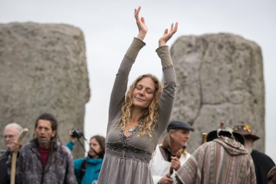 A woman dances during a fall equinox celebration at