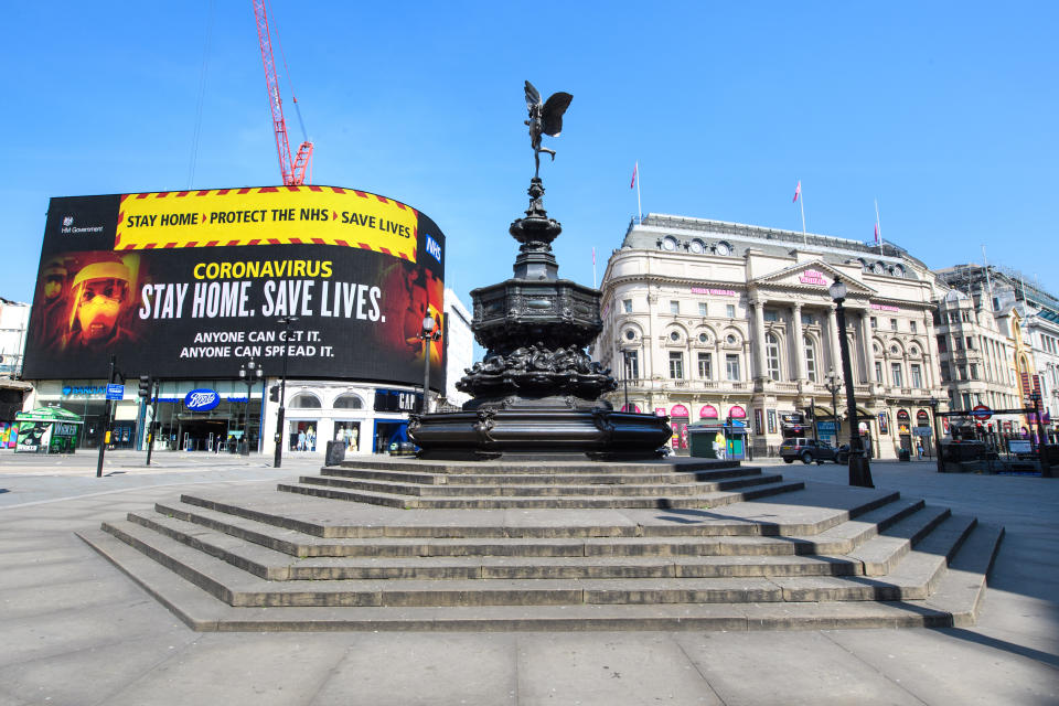 Adverts encouraging people to stay at home are displayed in an empty Picadilly Circus, as the UK continues its lockdown to help curb the spread of the coronavirus. Picture date: Thursday April 9, 2020. Photo credit should read: Matt Crossick/Empics