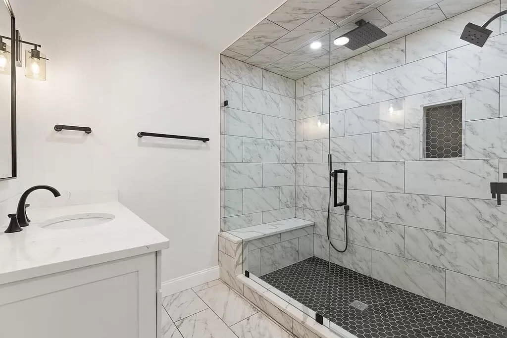 This house at 2 Cooper Lane in Easton sold for $1,400,000 on Feb. 16. 2024.The bath has two vanities and a "show stopping 6-foot tiled shower," according to the real estate listing.