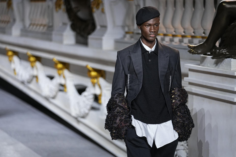 A model wears a creation for the Dior fall-winter 22/23 men's collection, in Paris, Friday, Jan. 21, 2022. (AP Photo/Michel Euler)