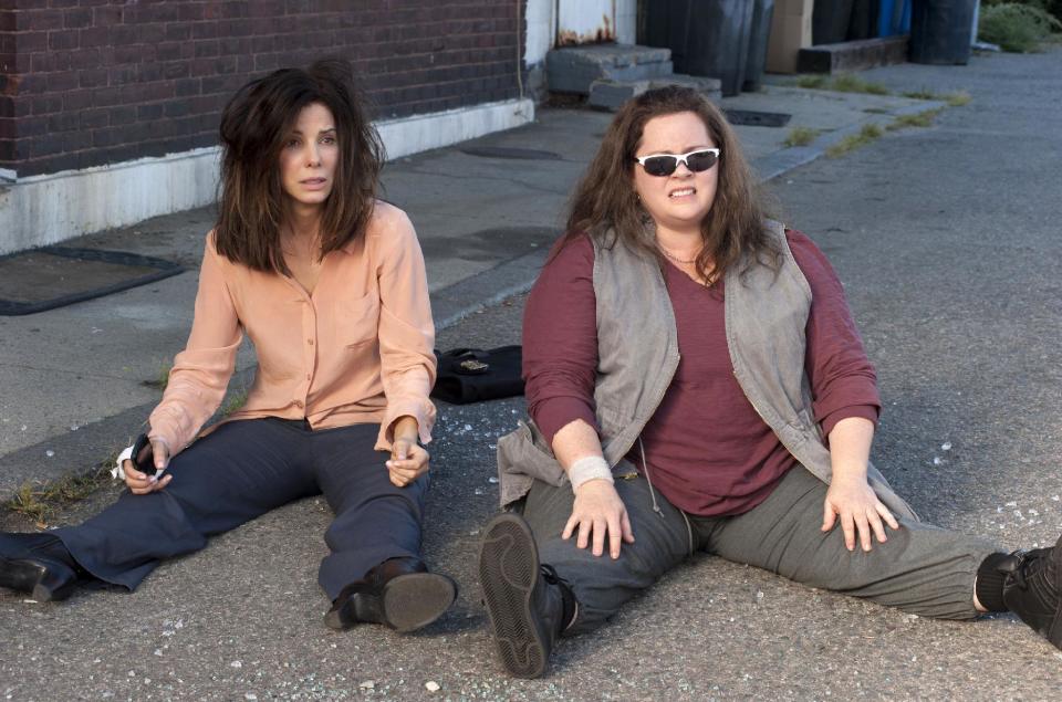 This film publicity image released by 20th Century Fox shows Sandra Bullock as FBI Special Agent Sarah Ashburn, left, and Melissa McCarthy as Boston Detective Shannon Mullins in a scene from "The Heat." (AP Photo/20th Century Fox, Gemma La Mana)