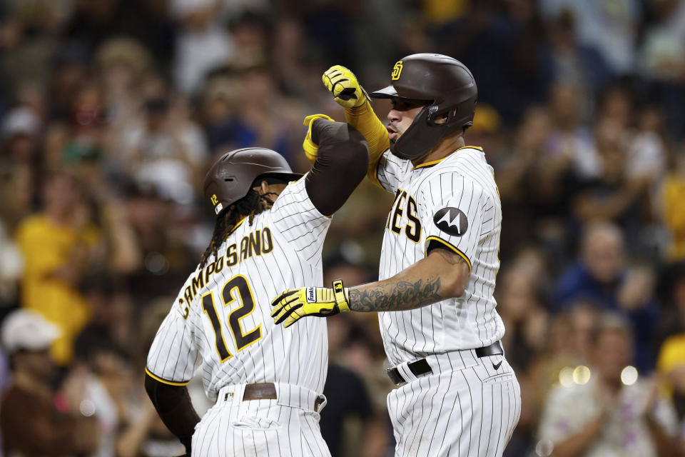San Diego Padres' Gary Sanchez, right, celebrates with Luis Campusano (12) after hitting a two-run home run against the Pittsburgh Pirates during the eighth inning of a baseball game Tuesday, July 25, 2023, in San Diego. (AP Photo/Derrick Tuskan)