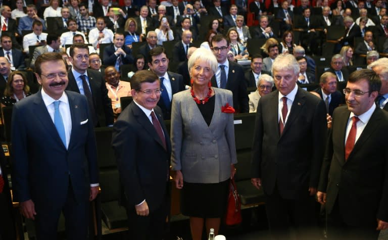 Turkish Prime Minister Ahmet Davutoglu (2ndL) and International Monetary Fund (IMF) Managing Director Christine Lagarde (C) take part in the G20 finance ministers meeting in Turkey, on September 4, 2015 in Ankara