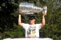 FILE PHOTO: Pittsburgh Penguins captain, Sidney Crosby, hoists the Stanley Cup while taking part in the Natal Day Parade in Halifax