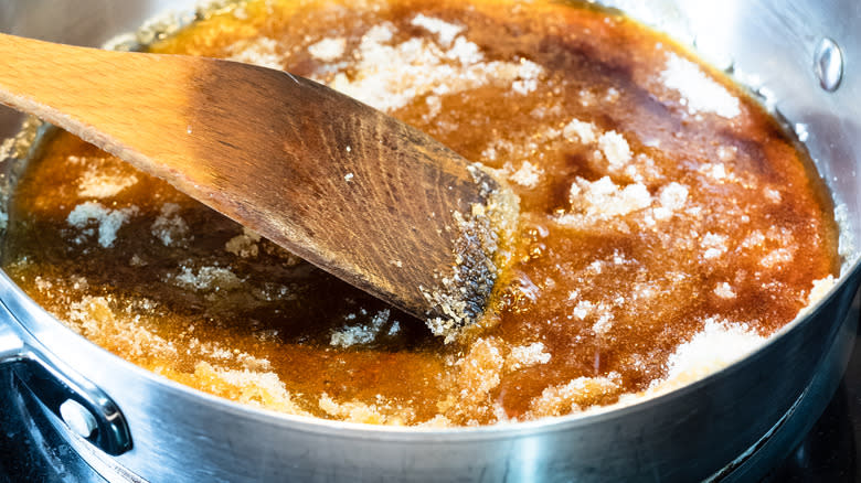 stirring caramel in pot
