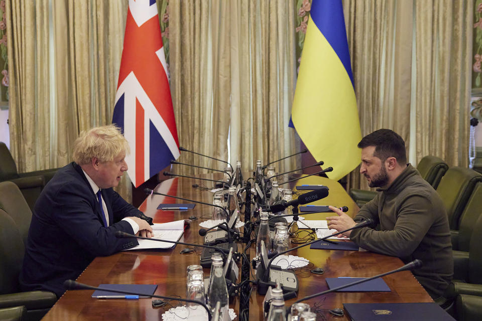 FILE - In this image provided by the Ukrainian Presidential Press Office, Ukrainian President Volodymyr Zelenskyy, right, and Britain's Prime Minister Boris Johnson speak, during their meeting in Kyiv, Ukraine, Saturday, April 9, 2022. When Johnson survived a no-confidence vote this week, at least one other world leader shared his relief. Zelenskyy said it was “great news” that “we have not lost a very important ally.” It was a welcome endorsement for a British leader who divides his country, and his party, but has won wide praise as an ally of Ukraine. (Ukrainian Presidential Press Office via AP, File)