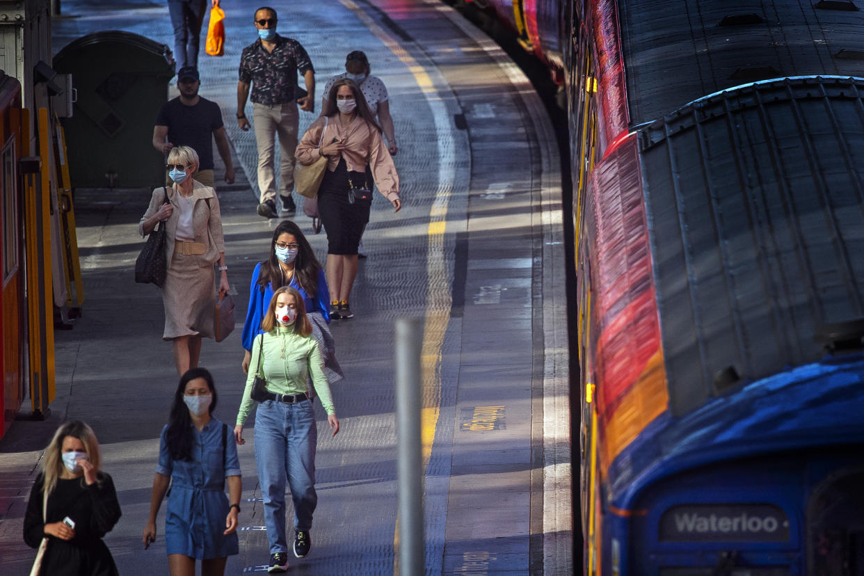 Passengers wearing face masks at Waterloo station in London as face coverings become mandatory on public transport in England with the easing of further lockdown restrictions during the coronavirus pandemic.