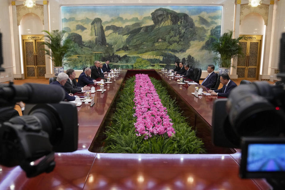 Journalists film Chinese President Xi Jinping, second right, and U.S. Senate Majority Leader Chuck Schumer, D-N.Y., third left, attend a bilateral meeting at the Great Hall of the People in Beijing, Monday, Oct. 9, 2023. (AP Photo/Andy Wong, Pool)